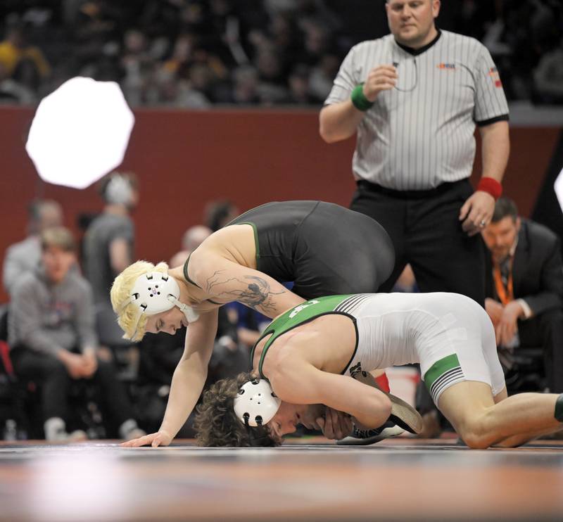 Crystal Lake South’s Nathan Randle is held by Providence Catholic’s Tommy Banas in the Class 2A 138-pound bout at the boys IHSA wrestling finals at State Farm Center in Champaign on Saturday, Feb. 21, 2026.