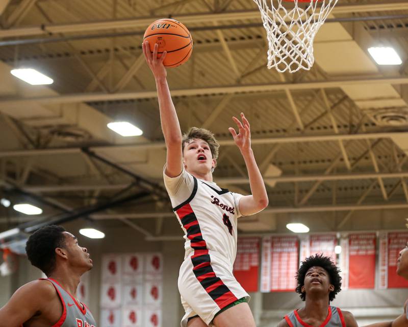Benet's Daniel Pauliukonis (4) puts in a layup during their When Sides Collide Shootout basketball tournament matchup between Rich Township at Benet Academy. Jan 25, 2025 in Lisle.