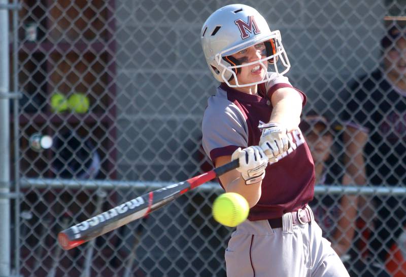 Marengo’s Lilly Kunzer connects for a double against Richmond-Burton in varsity softball at Richmond Thursday night.