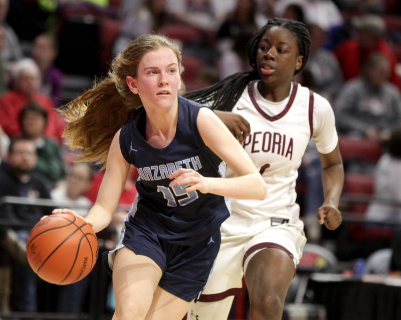 Nazareth Academy's Mary Bridget Wilson drives toward the basket during the Class 3A girls basketball state semifinal against Peoria at Redbird Arena in Normal on Friday, March 3, 2023.
