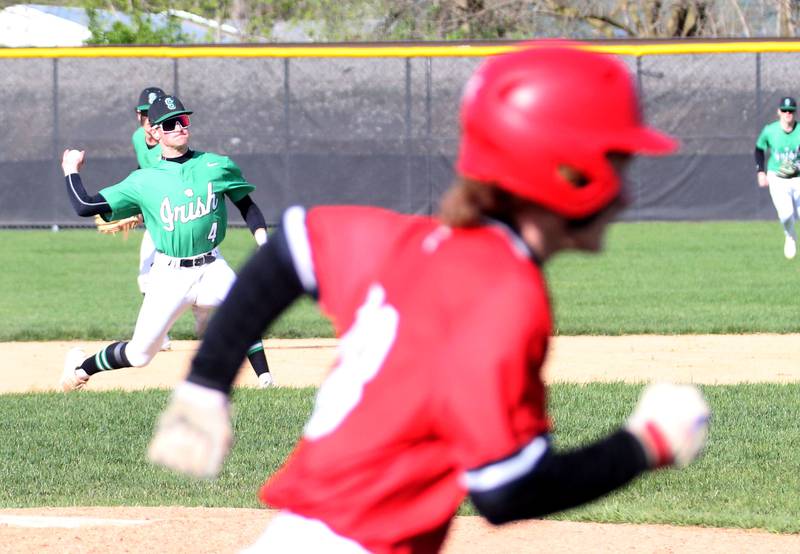 Seneca's Austin Aldridge fires a throw to first base to force out Streator's Keegan Angelico on Friday, April 19, 2024 at Seneca High School.