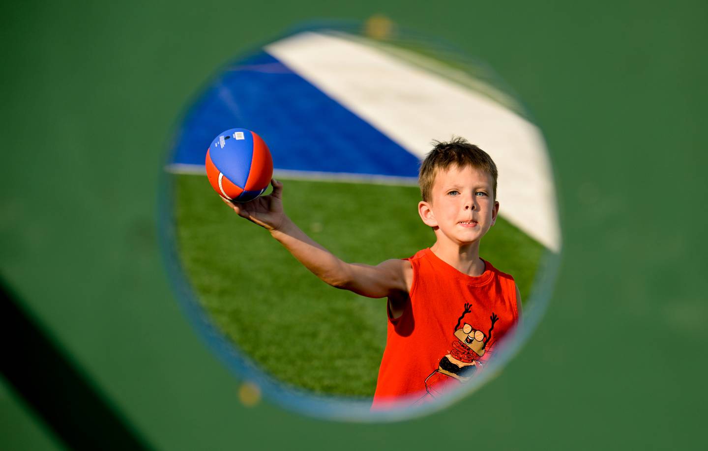James Young, 6 of Batavia tries to hit the spot at the Football Toss game during Geneva's first National Night Out event on Tuesday, Aug 5, 2025 in Geneva.