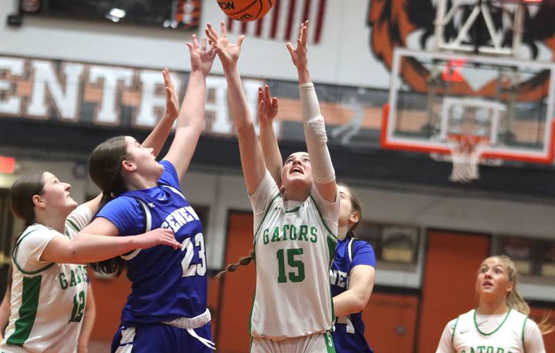 Crystal Lake South’s Gaby Dzik, left, and Tessa Melhuish, center right, battle Geneva’s Nora Hatton, center left, for the ball in girls IHSA Class 3A Sectional Championship basketball on Thursday, Feb. 26, 2026, at Crystal Lake Central High School in Crystal Lake.
