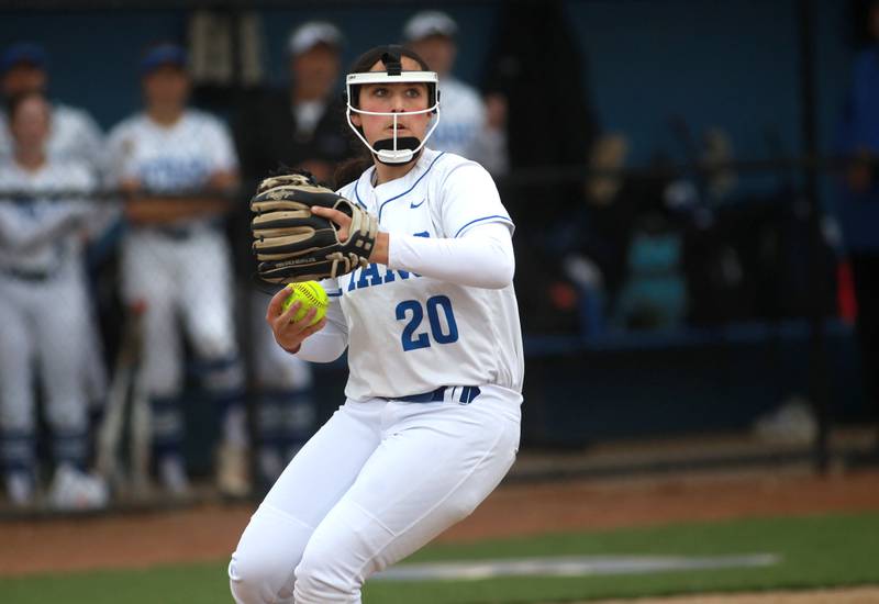 St. Charles North's Julianna Kouba throws to first for an out after catching a bunt during a game against Lake Park on Wednesday, April 30, 2025 in St. Charles.