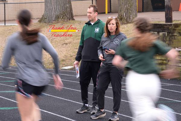 Glenbard West’s Kelly Hass and Paul Hass, husband and wife, are mainstays at school, in cross country and track programs