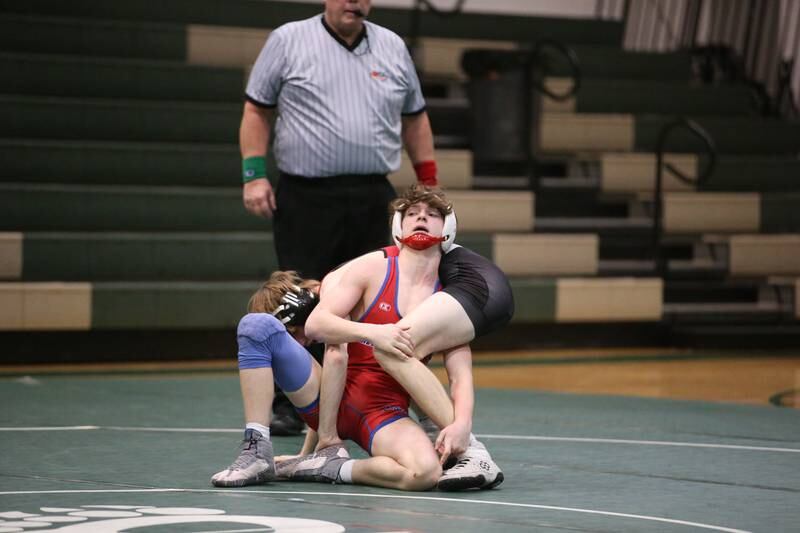 Morrison's Livi Milder wrestles Orion's Cole Perkins during a triangular meet on Wednesday, Jan. 18, 2023 at St. Bede Academy.