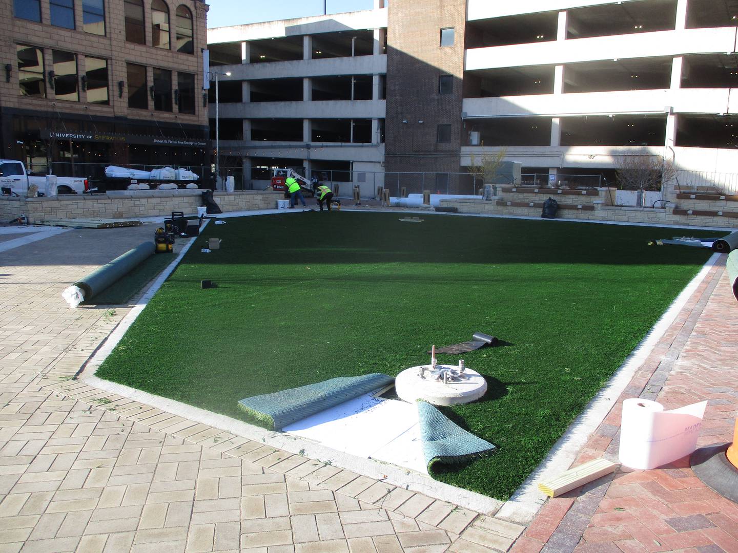 Construction crews last week first began installing artificial turf at the Joliet City Square. Nov. 14, 2025