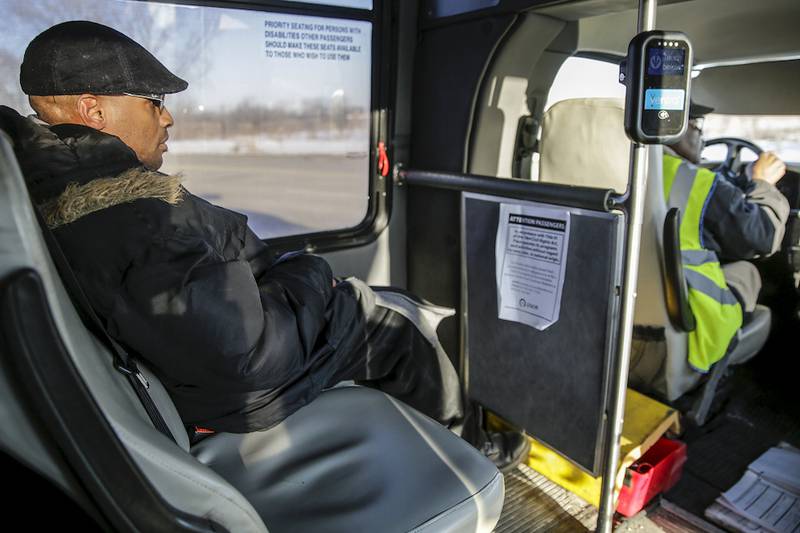 Sam Knight rides a Pace West Joliet Call-n-Ride bus to work Monday.