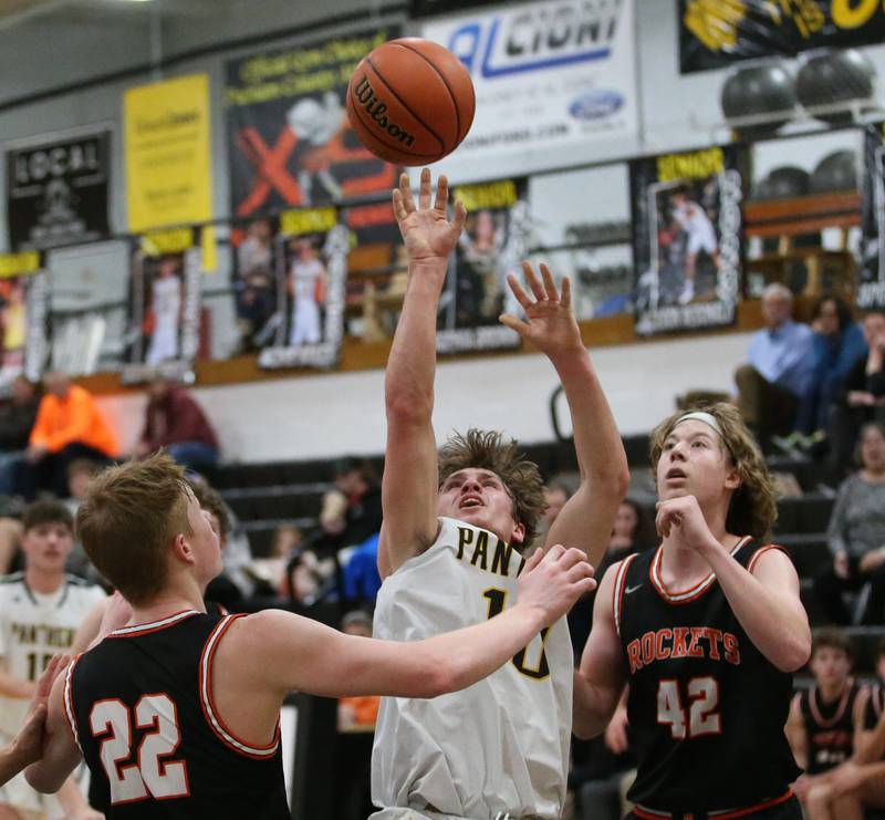 Putnam County's Austin Mattingly shoots a jump shot between Roanoke-Benson's Nolan Hunter and Zeke Kearfott during the Tri-County Conference Tournament on Tuesday, Jan. 24, 2023 at Putnam County High School.