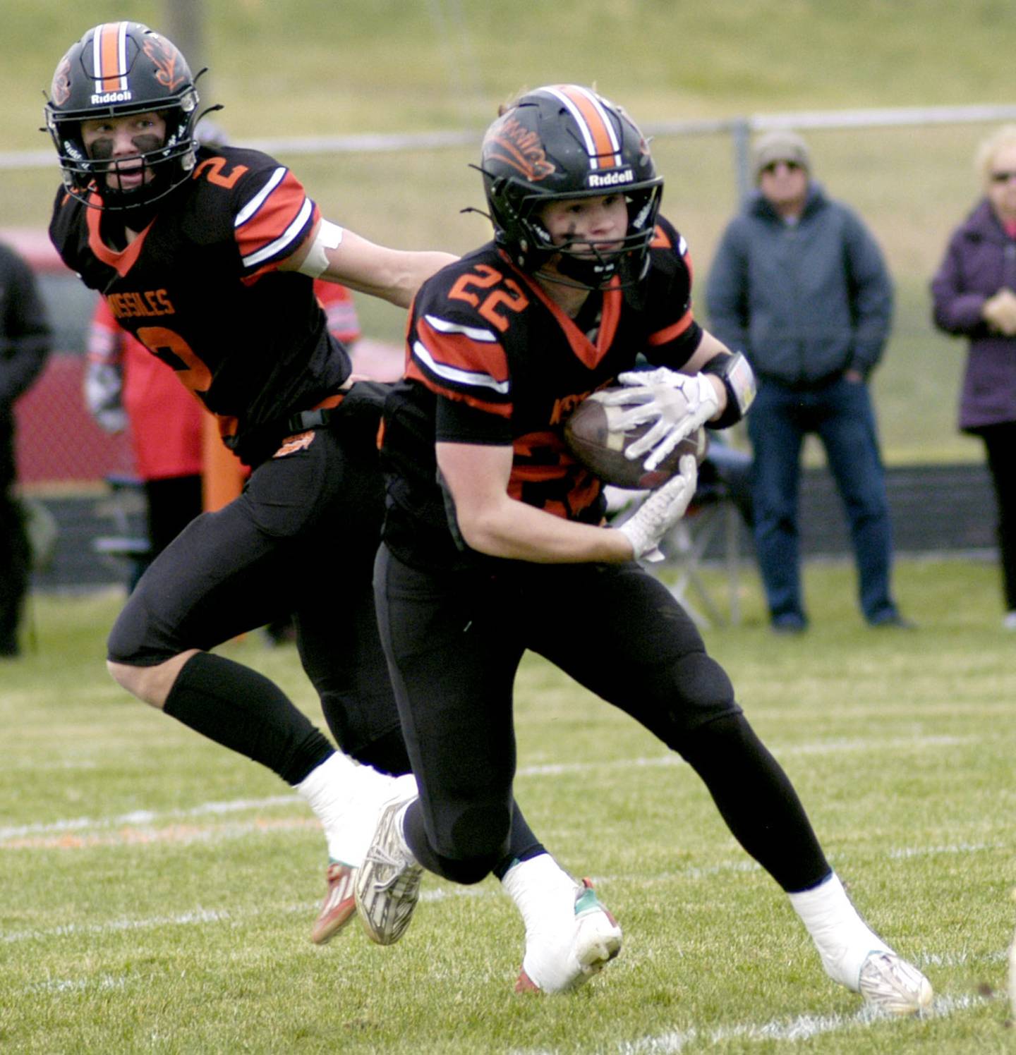 Milledgeville's Jayden Promenschenkel takes a handoff from Kyson Francis. The Milledgeville Missiles defeated the South Beloit SoBos 22-6 in Round 2 of the I8FB playoffs. The game took place at Milledgeville on Saturday, November 8th, 2025