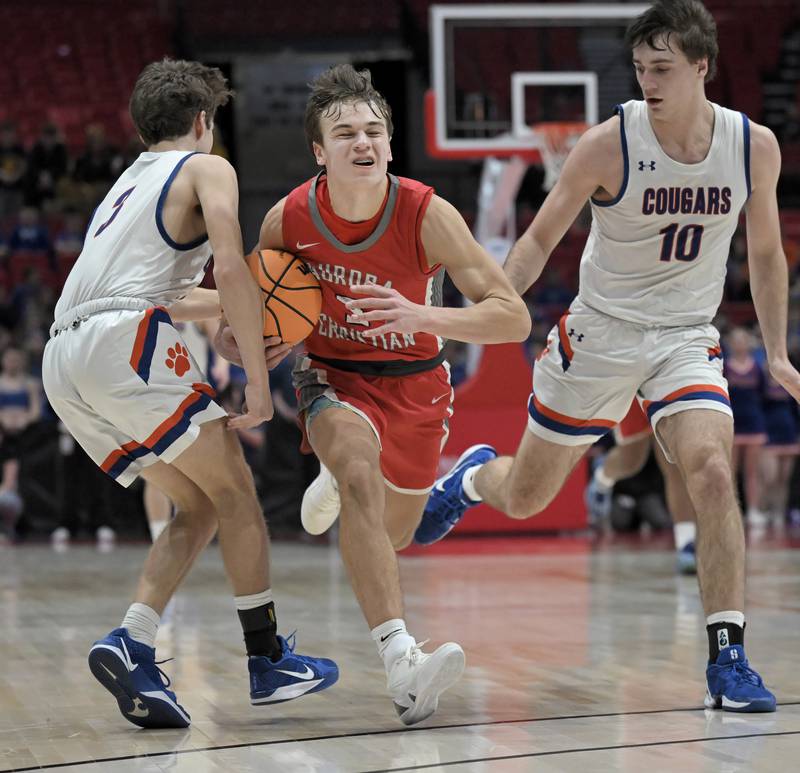 Aurora Christian’s Preston Morel tries to draw a fould from Eastland’s Tanner Stern in a IHSA Class 1A boys basketball supersectional at Northern Illinois University in DeKalb on Monday, Mar. 10, 2025.