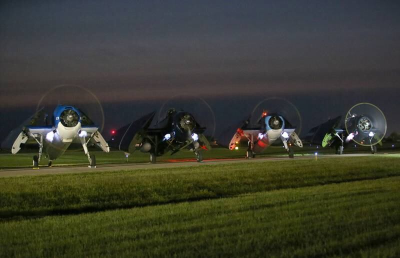 TBM Avengers emits flames during the TBM Night Run-up of the the TBM Avenger Reunion on Friday, May 19, 2023 at the Illinois Valley Regional Airport in Peru.