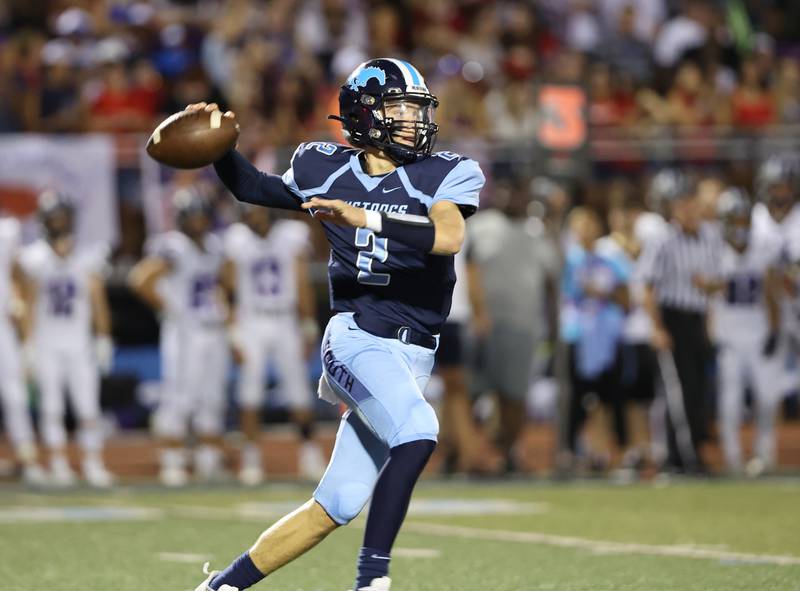 Downers Grove South’s William Potter looks for a receiver against Downers Grove North during the boys varsity football game on Friday, Sept. 1, 2023.