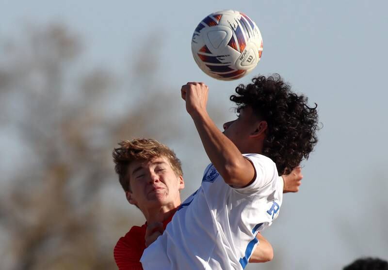 Huntley’s Gavin Eagan, left, battles Larkin’s  Anthony Cordova in boys soccer regional action at South Elgin on Saturday.