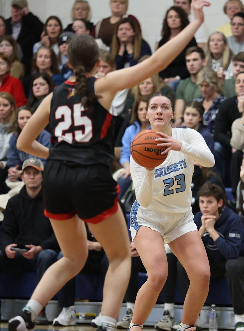Nazareth's Danielle Scully (23) takes aim at the basket during the girls varsity basketball game between Benet and Nazareth academies on Wednesday, Jan. 3, 2023 in La Grange Park, IL.