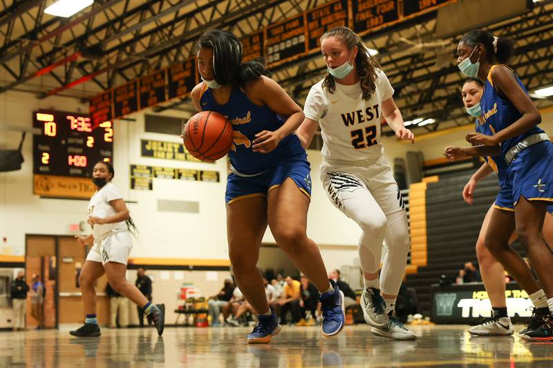Joliet Central’s Kiyah Davis chases down the loose ball against Joliet West. Tuesday, Feb. 8, 2022, in Joliet.