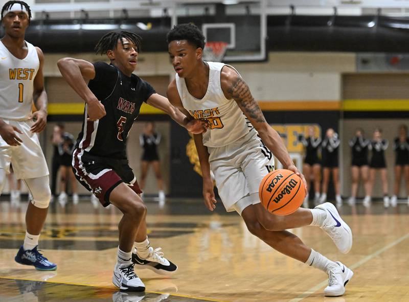 Joliet West's Zion Gross (10) drives to the basket during a conference game against Plainfield North on Friday, Dec. 20, 2024, at Joliet.