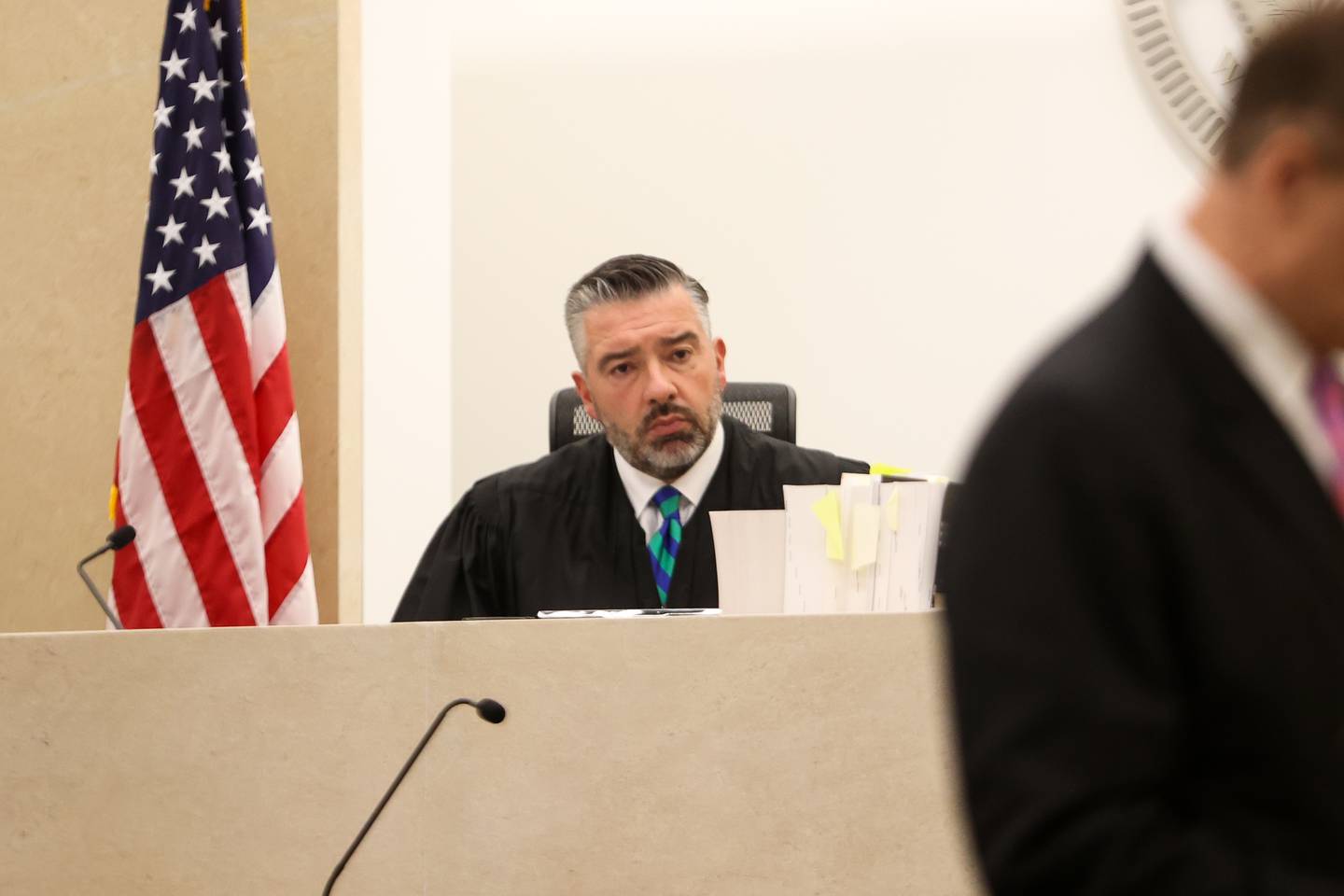 Judge Dave Carlson listens as defense attorney Chuck Bretz gives opening comments. Boshears is charged with the murder of Kaitlyn “Katie” Kearns, 24, on Nov. 13, 2017. Thursday, April 14, 2022, in Joliet.