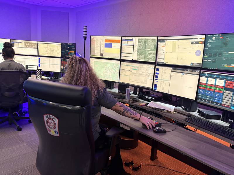 SEECOM dispatcher Mya Warner takes a call in the dispatch center in Crystal Lake, Monday, April 20, 2026.