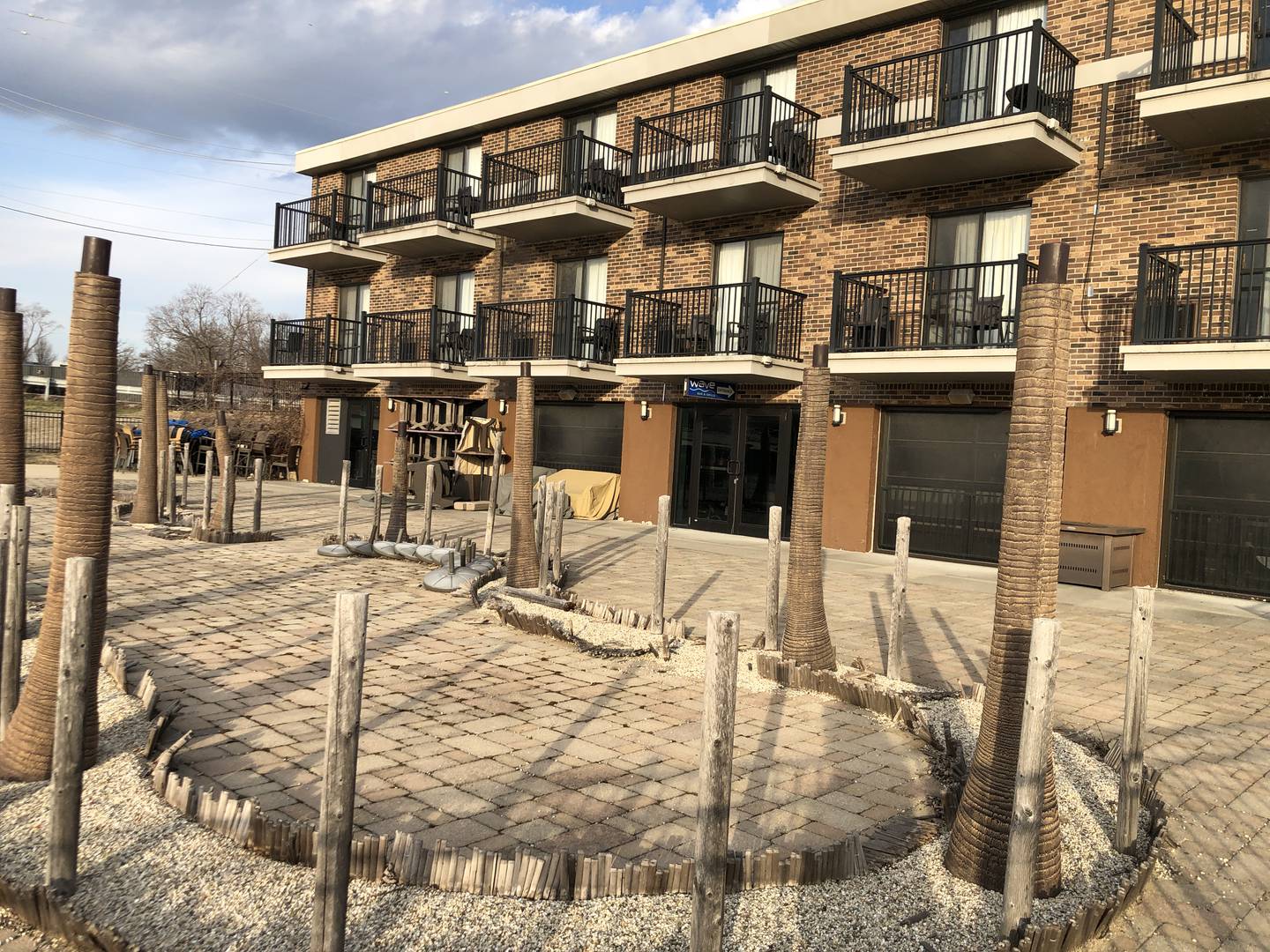 Mario Arcari purchased former Paradise Cove Motel, spending $1 million renovating it and the basement storage space facing the Fox River into The Wave Bar & Grille in 2016. The restaurant closed after his death in 2018.