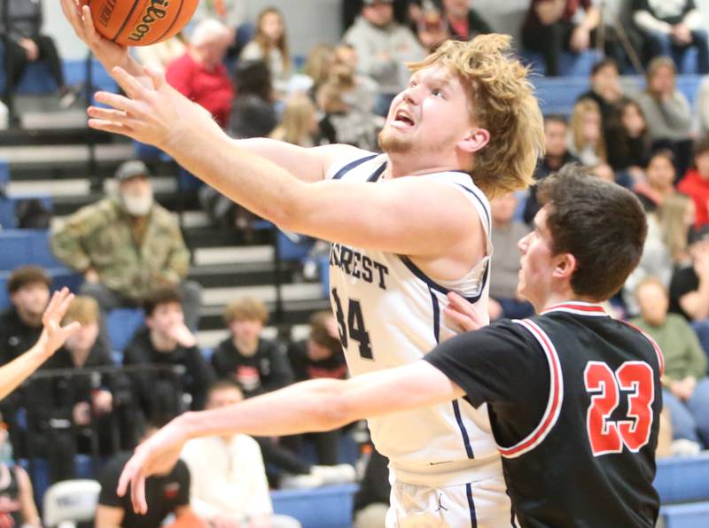 Fieldcrest's Koltin Kearfott eyes the hoop while being guarded by Woodland's Nick Plesko on Tuesday, Dec. 19, 2023 at Fieldcrest High School.