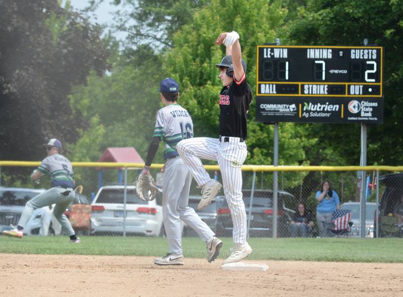 Fulton Evan Folk strikes a pose at second base as he looks to his teammates in their dugout after getting a hit in the seventh inning against River Ridge/Scales Mound at the 1A Lena-Winslow Sectional final on Saturday, May 31, 2025. Folk scored on a hit by Braedon Myers to give the Steamers a 3-1 lead.