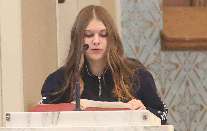 Lovelyn Beck, a student at Academy of St. Carlo Acutis, gives petitions during the first ever all-school Mass on Friday, Jan. 30, 2026 at St. Joseph’s Catholic Church in Peru.