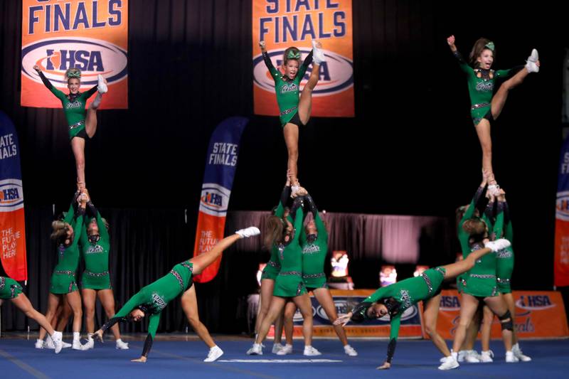 Members of the Providence Catholic cheerleading team compete in the medium team division of the IHSA State Finals on Saturday, Feb. 8, 2025 at Grossinger Motors Arena in Bloomington.
