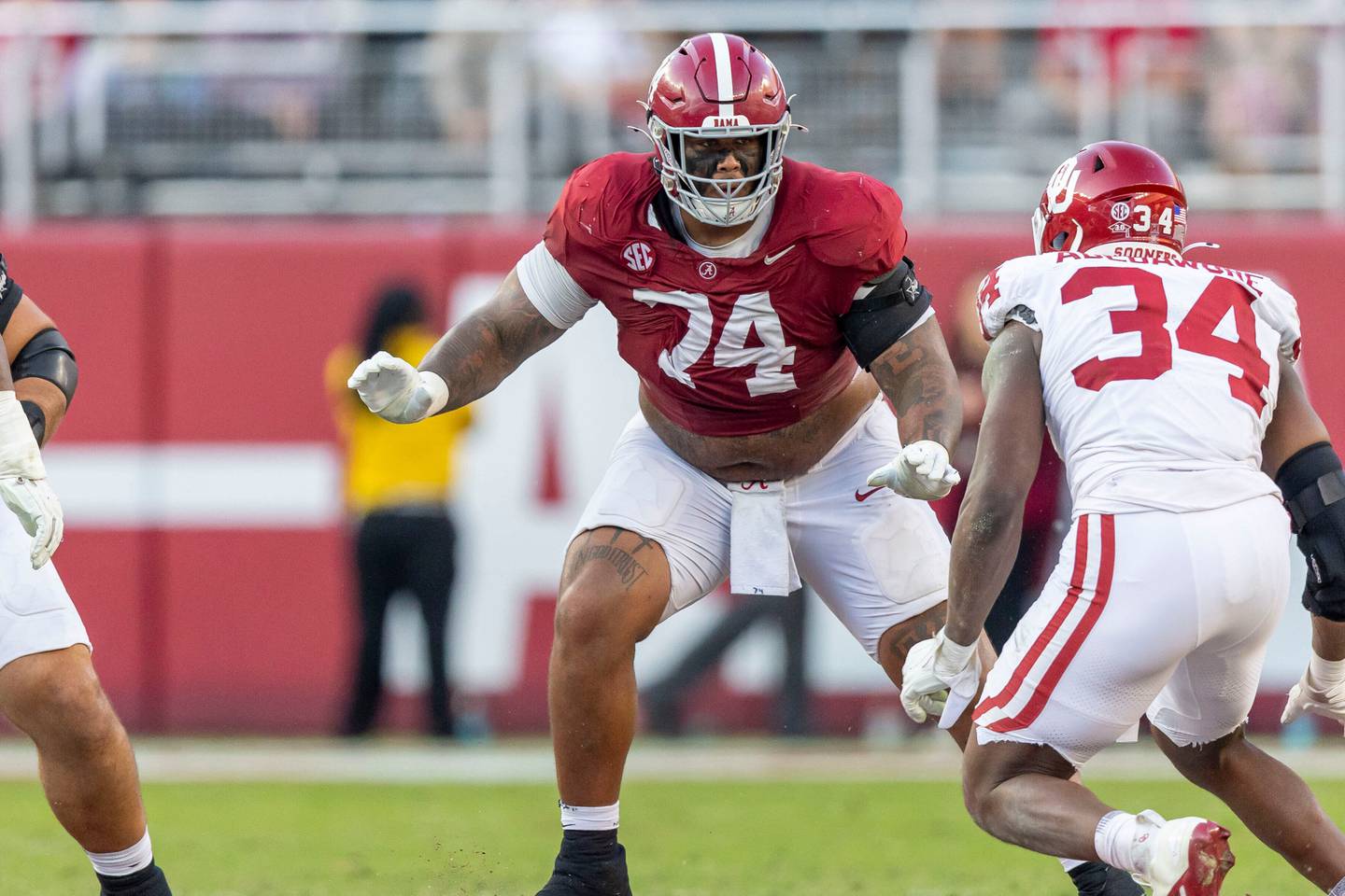 Alabama offensive lineman Kadyn Proctor (74) sets up to block against Oklahoma defensive lineman Adepoju Abebawore (34) during the first half of an NCAA college football game, Saturday, Nov. 15, 2025, in Tuscaloosa, Ala. (AP Photo/Vasha Hunt)