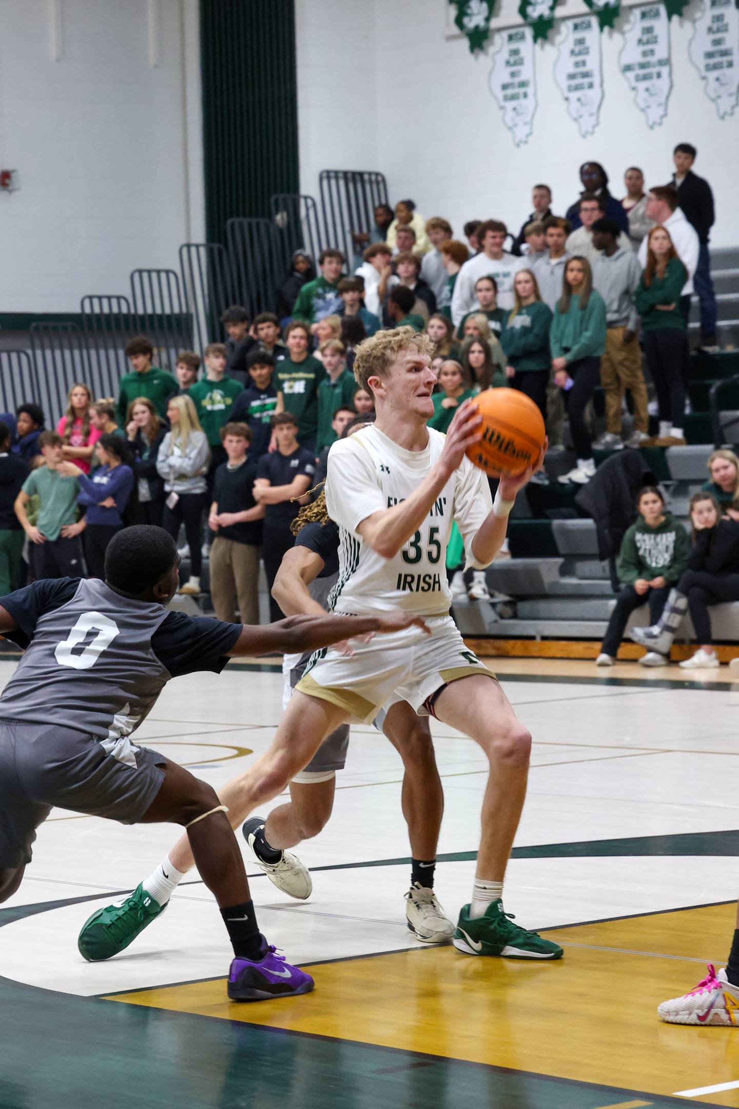 Bishop McNamara's Richie Darr steps toward the basket during the Fightin' Irish's 70-51 loss to Hope Academy on Tuesday, Dec. 9, 2025