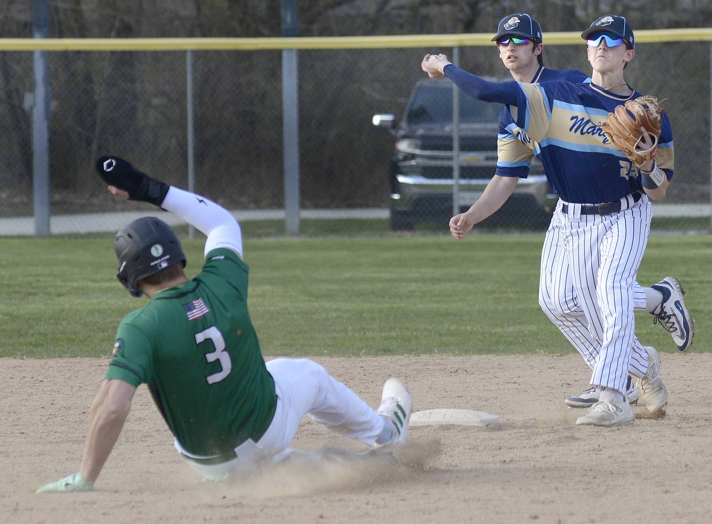 Marquette’s Griffin Dobberstein completes a double play as Dwight’s Luke Gallet attempts to break it up Thursday at Masinelli Field in Ottawa