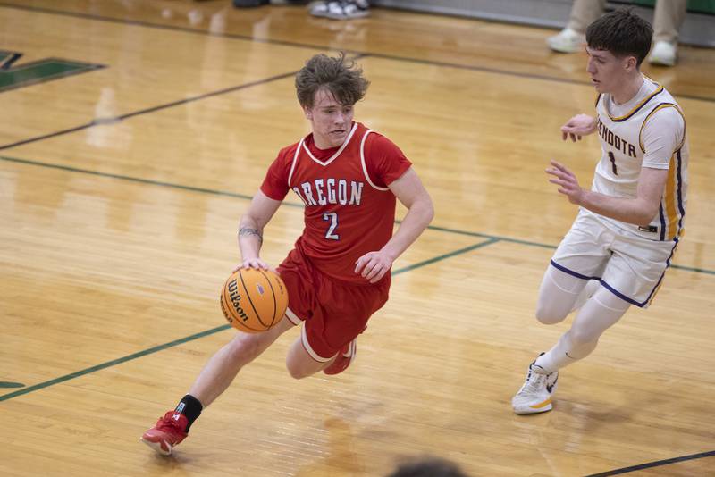 Oregon’s Cooper Johnson handles the ball against Mendota’s Cole Tillman Friday, Feb. 27, 2026, at the Class 2A Rock Falls boys basketball regional.