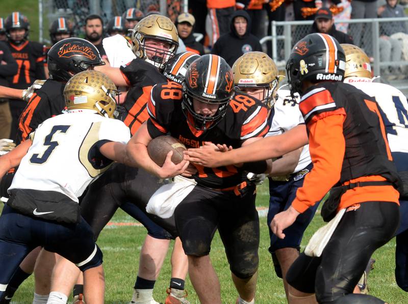 Milledgeville's Karter Livengood (48) carries the ball for a gain during 8-man playoff action against Polo on Saturday, Nov. 16, 2024 at Milledgeville.