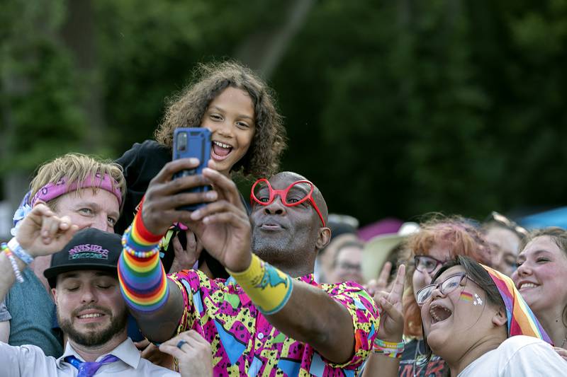 Chris Shern, front man for Invisible Cartoons, snaps a selfie with fans after their set Saturday, June 14, 2025, at Sauk Valley Pride Fest in Dixon.