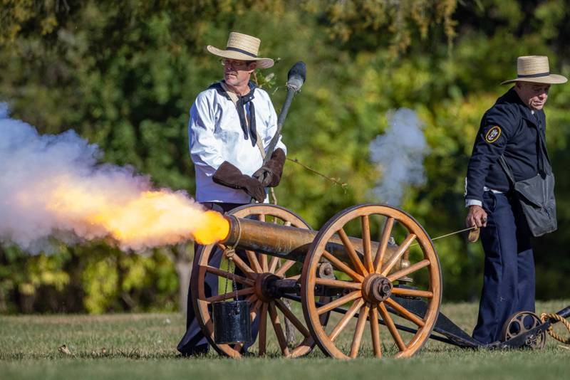 A Union Artillery unit fires a canon on the battlefield against Confederate troops during The Blue and Gray Civil War reenactment at City County Park on October 10, 2025 in Princeton.