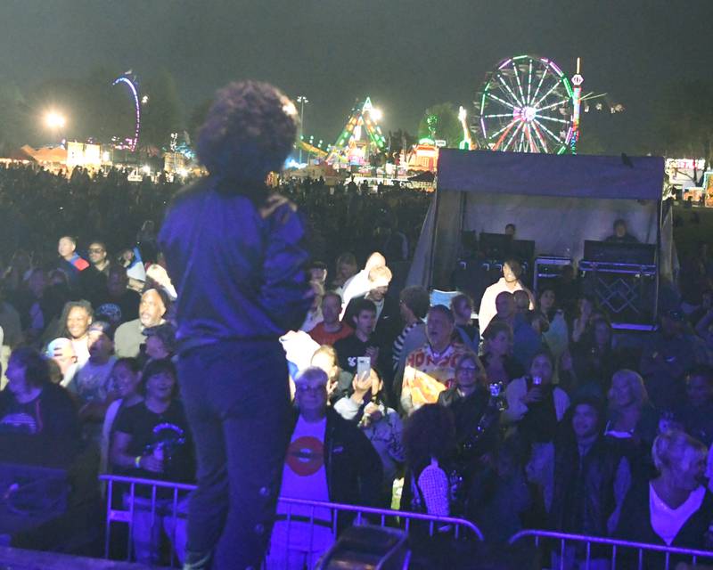 Community members enjoy the music of The Prince Experience a Prince Tribute band on Thursday June 12, 2025, during PrairieFest held at PrairieFest Park in Oswego.