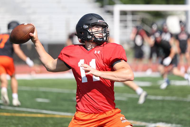 Minooka’s Gavin Dooley passes during a scrimmage against Lincoln-Way Central. Tuesday, June 28, 2022 in New Lenox.