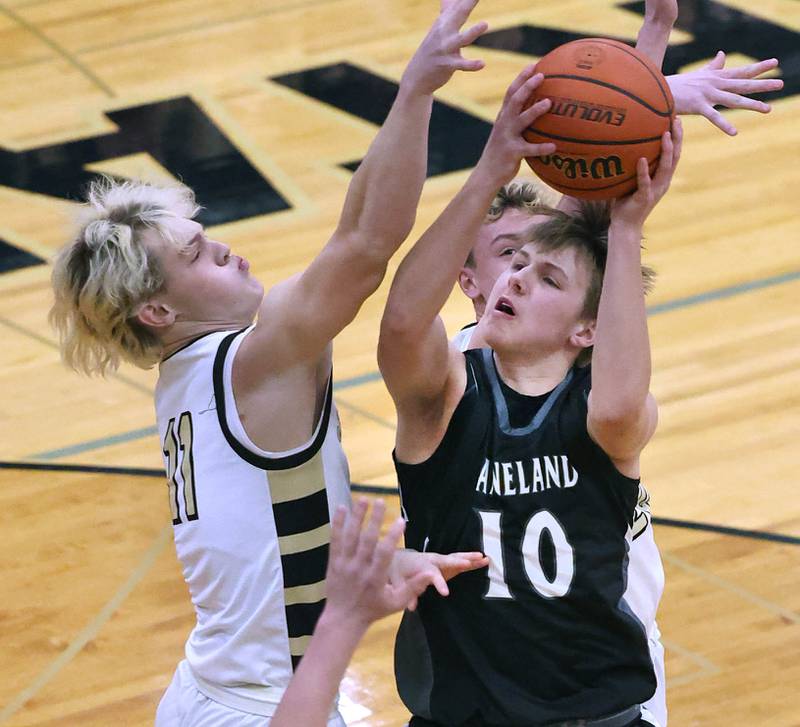 Kaneland's Troyer Carlson tries to shoot over Sycamore's Burke Gautcher during their game Friday, Feb. 10, 2023, at Sycamore High School.