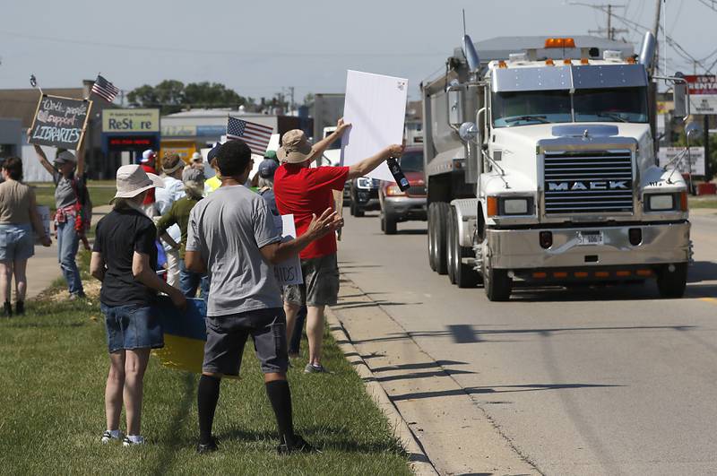 Protesters line Route 31 in front of the McHenry Public Library on Friday, June 20, 2025, during a Save Our Libraries Protest hosted by Indivisible McHenry County to draw attention to cuts to the nation’s libraries by the Trump administration.