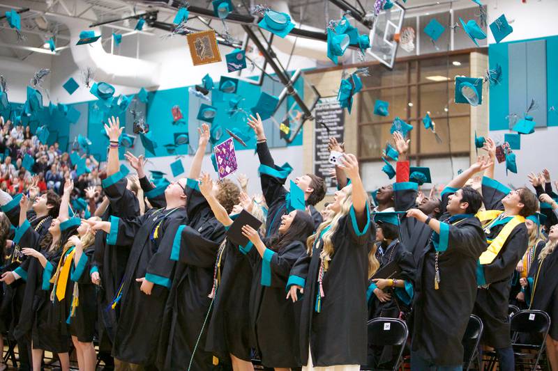 Graduates celebrate graduating at Woodstock North's Graduation Ceremony on Saturday, May 13, 2023 in Woodstock.