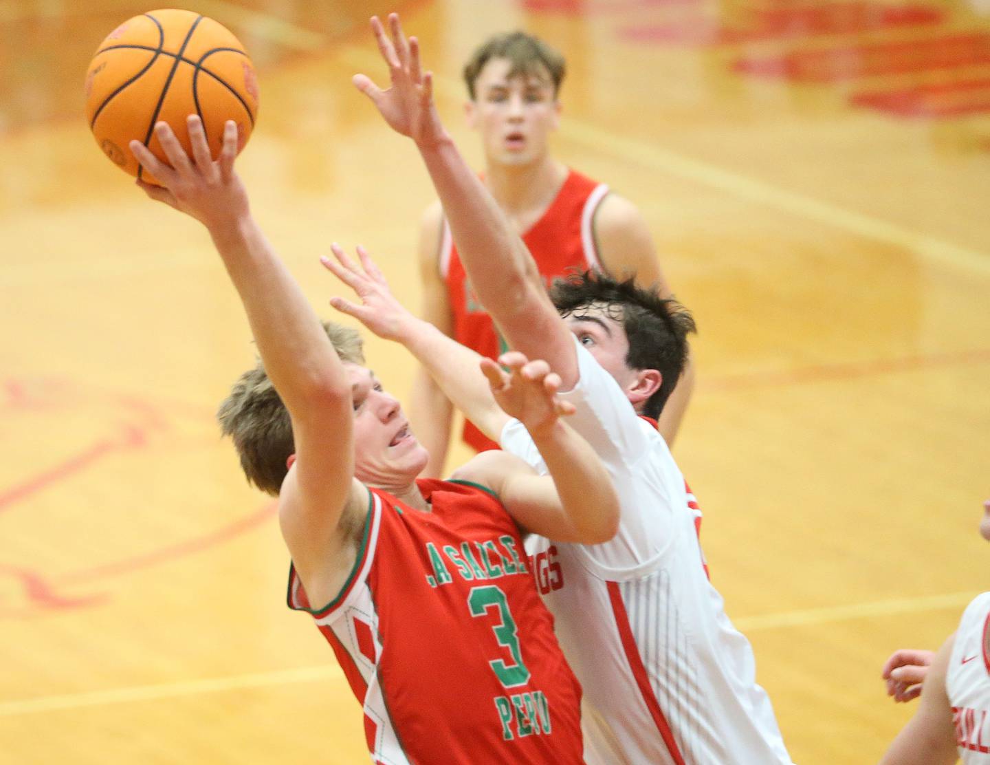 L-P's Braylin Bond works his way inside the lane as Streator's Colin Byers defends on Tuesday, Jan. 13, 2026 in Pops Dale Gymnasium at Streator High School.