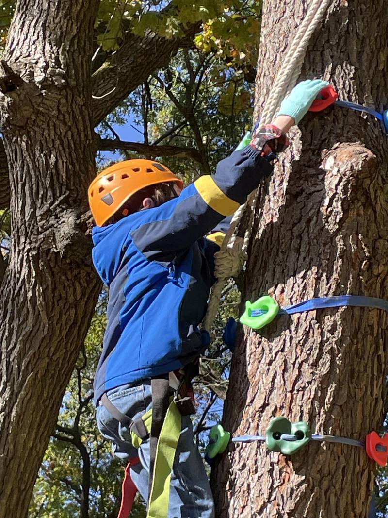 Cole Santee battles his fear of heights while tree climbing at Echo Bluffs.