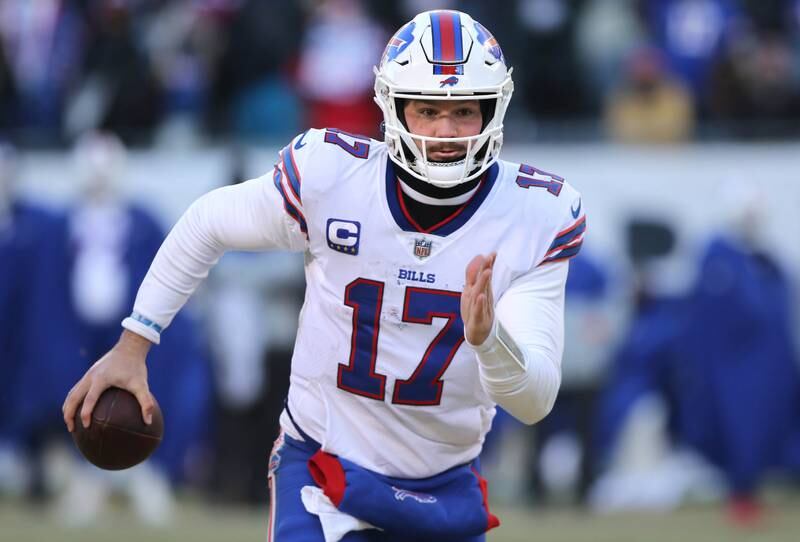 Buffalo Bills quarterback Josh Allen gets outside of the Chicago Bears defense for a touchdown during their game Sunday, Dec. 24, 2022, at Soldier Field in Chicago.