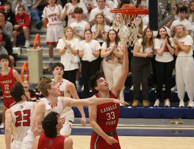 L-P's Eric Sotelo runs in for a layup against Metamora during the Class 3A Sectional on Tuesday, Feb. 27, 2024 at Pontiac High School.