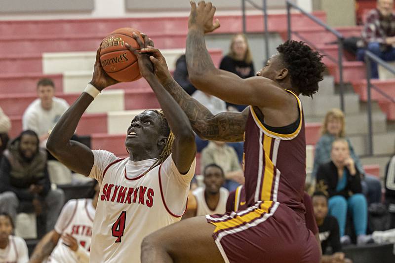 Sauk Valley’s Petia Dogale works to put up a shot against Indian Hills’ Kheni Briggs Thursday, Jan. 11, 2024 at SVCC.