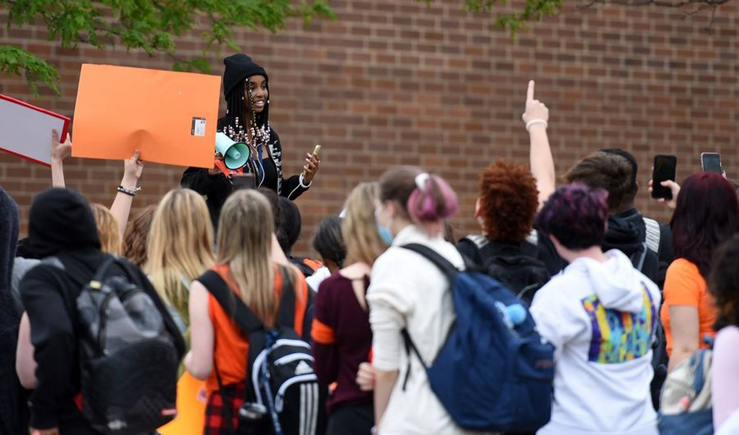 Mitchell Kariuki takes the megaphone to address the crowd at South Elgin High School who walked out of school as part of a nationwide effort to end gun violence. "It breaks my heart that I have to go to school everyday wondering if I'm safe. Every practice drill doesn't feel like a practice drill, it feels like real life," Kariuki said.