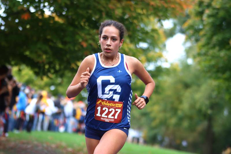 Cary-Grove’s Alexandra Santoyo finishes the Fox Valley Conference Cross Country Meet at McHenry County College in Crystal Lake on Saturday, October. 18, 2025.