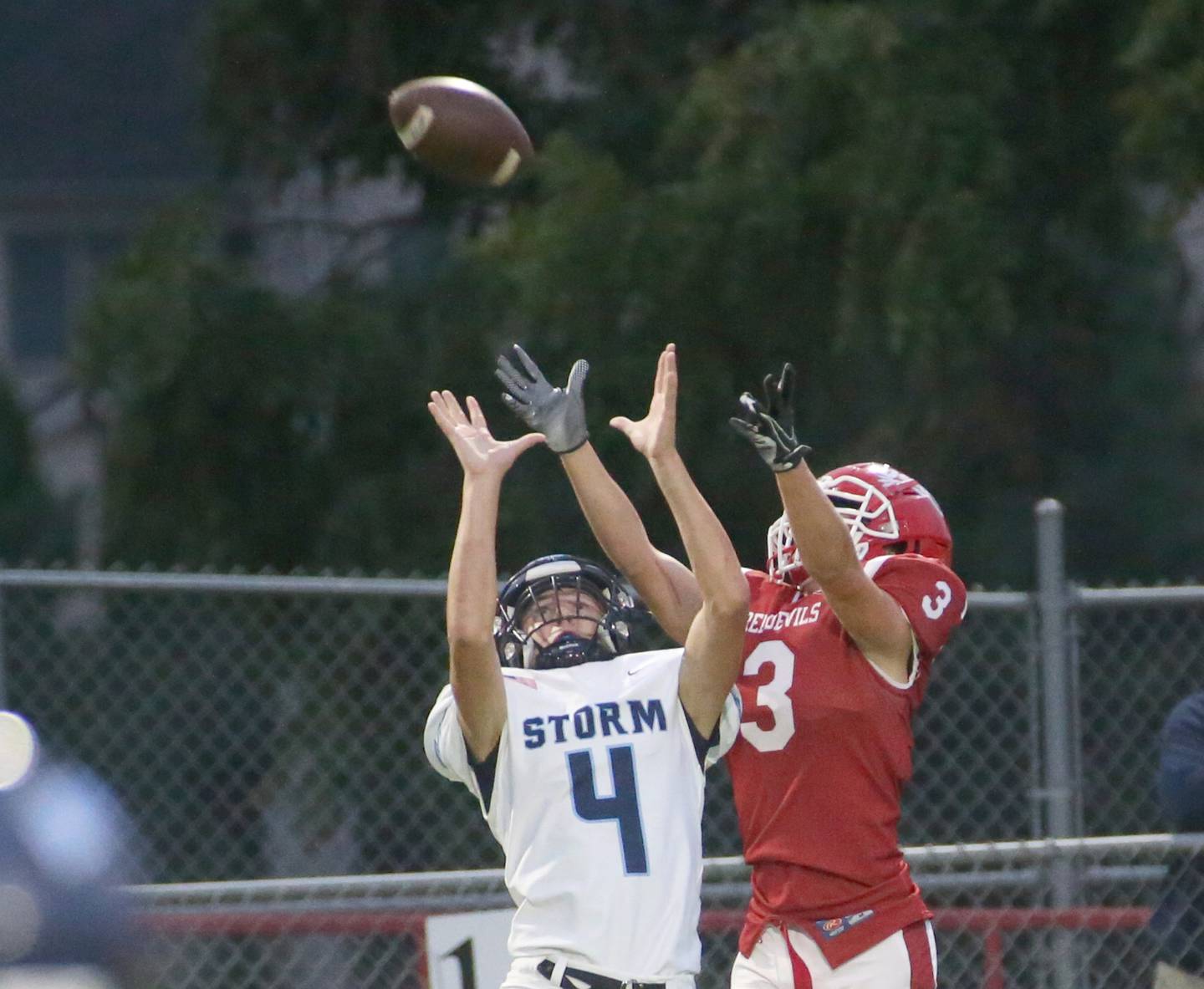 Bureau Valley's Brock Shane makes a catch over Hall's Ayden Lawless on Friday, Sept 8, 2023 at Richard Nesti Stadium.