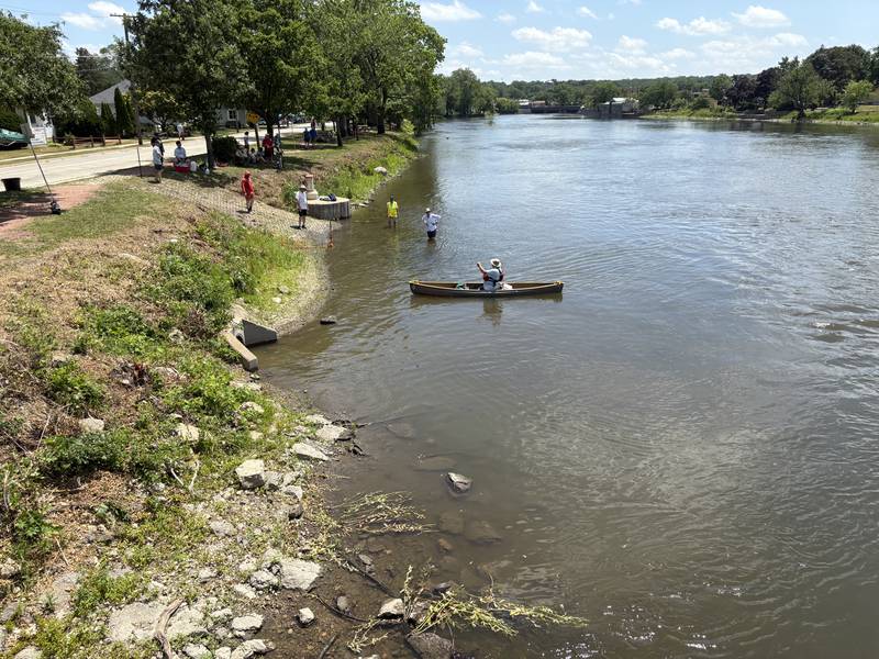 A paddler finishes the "El Cardunal" paddle in East Dundee June 22, 2025.