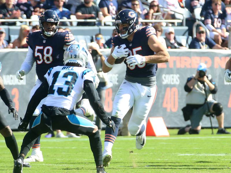 Chicago Bears tight end Cole Kmet runs with the ball as Carolina Panthers cornerback Troy Hill defends on Sunday, Oct. 6, 2024 at Soldier Field in Chicago.